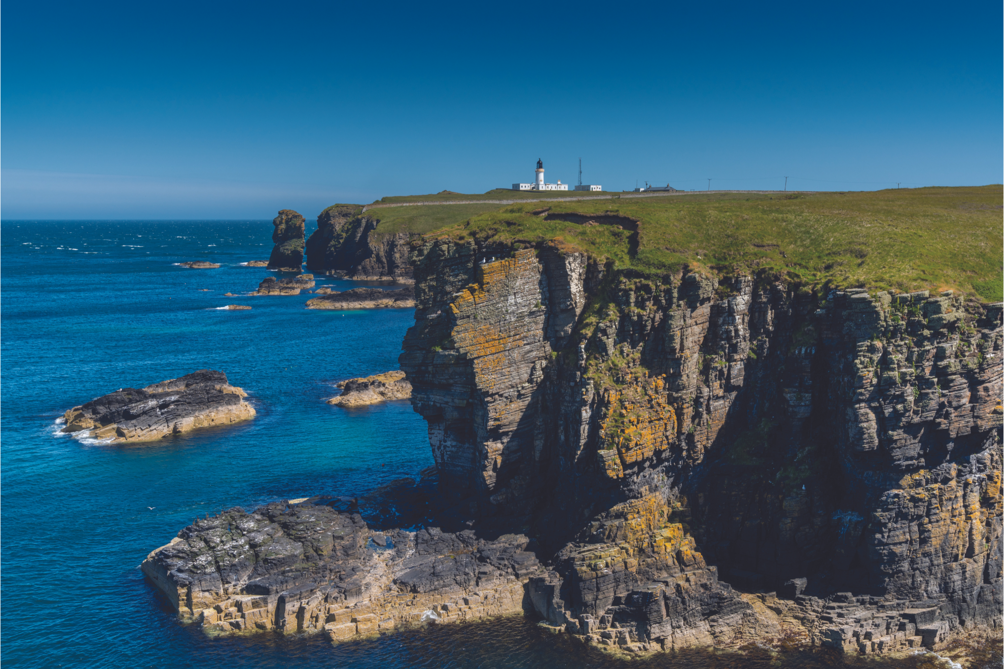 https://oldpulteney.appetite.dev/wp-content/uploads/2023/08/View-of-the-Wild-Caithness-Coast-and-the-Noss-Head-Lighthouse.png